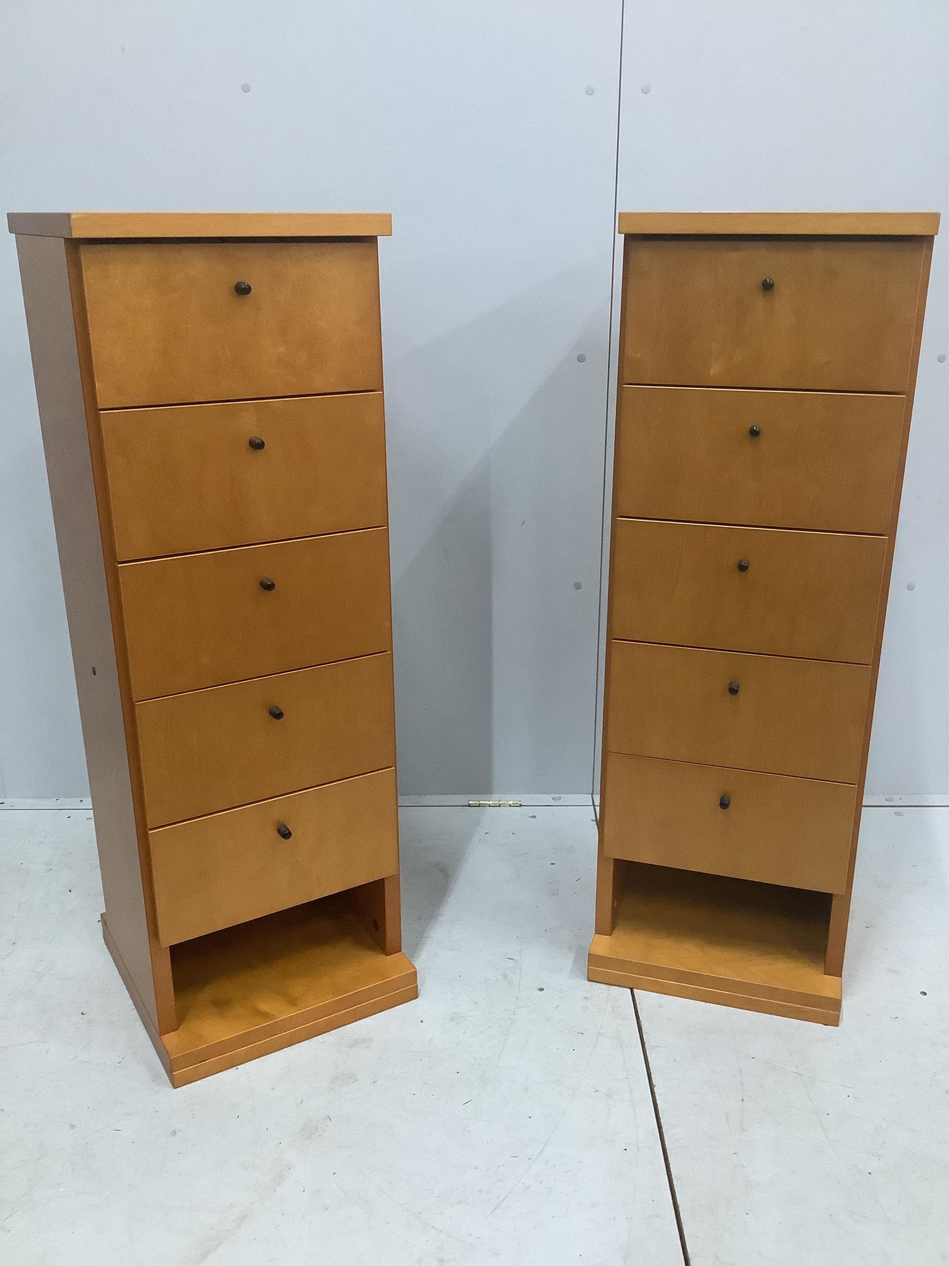 A pair of contemporary Finnish birch five drawer tall chests, width 38cm, depth 38cm, height 115cm. Condition - fair